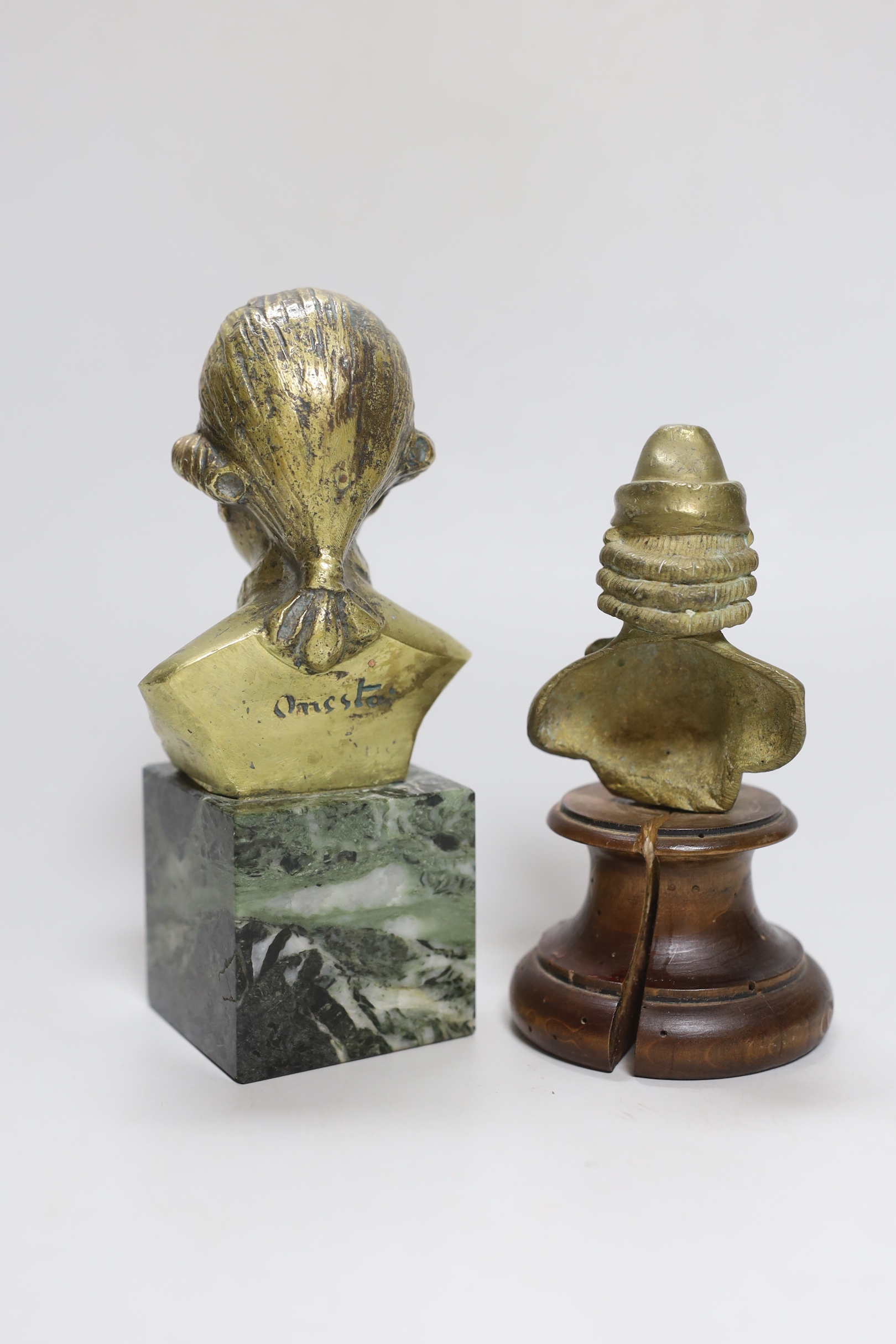 Onesta: A bronze bust of a musician, and a similar bust on wooden stand, Onesta bust 16.5cm high